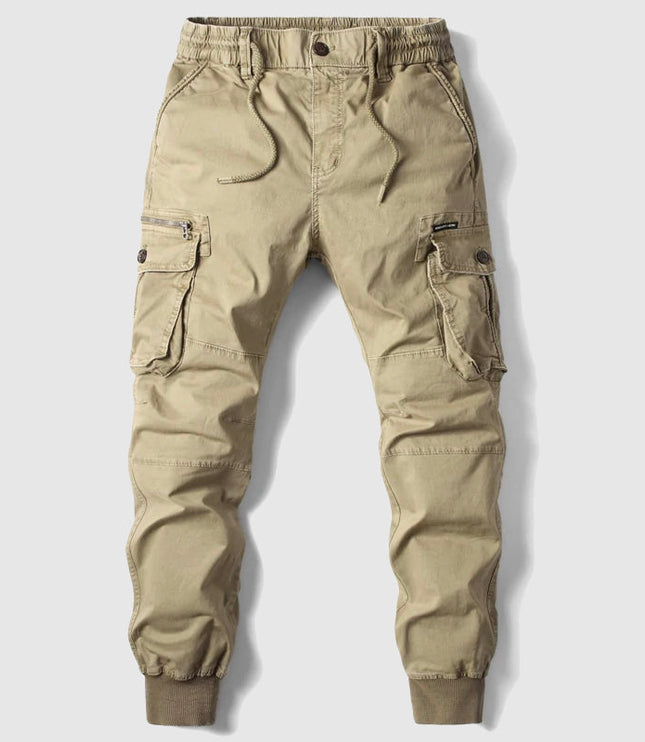 Beige men's cargo pants with multiple pockets and elastic waistband detail