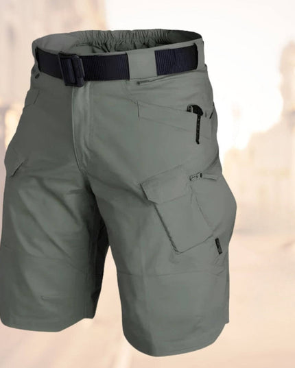 Sage green cargo shorts with navy striped belt and functional zip pockets