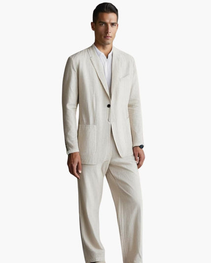 Man wearing cream linen notch lapel suit with straight pants and white shirt