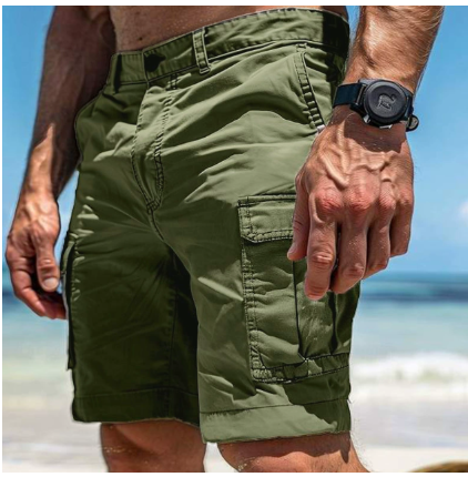 Olive green outdoor cargo shorts with side pockets worn at seaside