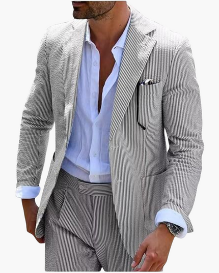 Close-up of gray pinstripe blazer with light blue shirt and chest pocket detail
