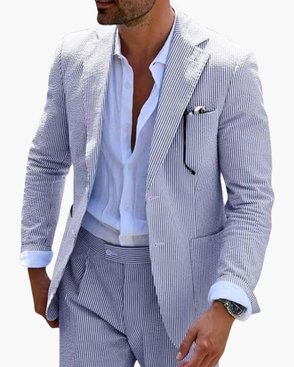 Upper torso view of blue pinstripe blazer with light blue dress shirt and pocket square