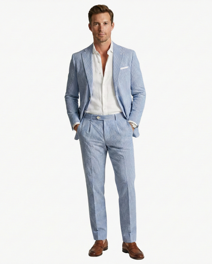 Blue vertical stripe men's summer suit front view with white shirt and cream pocket square
