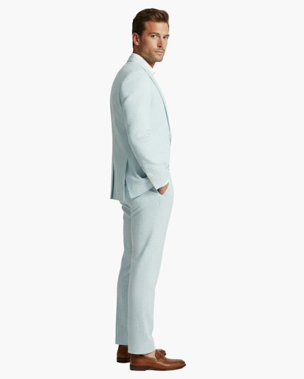 Side profile of light blue pinstripe linen suit jacket and slacks