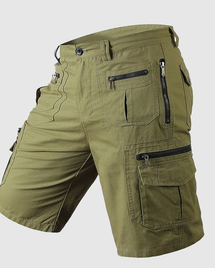 Olive green cargo shorts with multiple pockets and black zipper accents