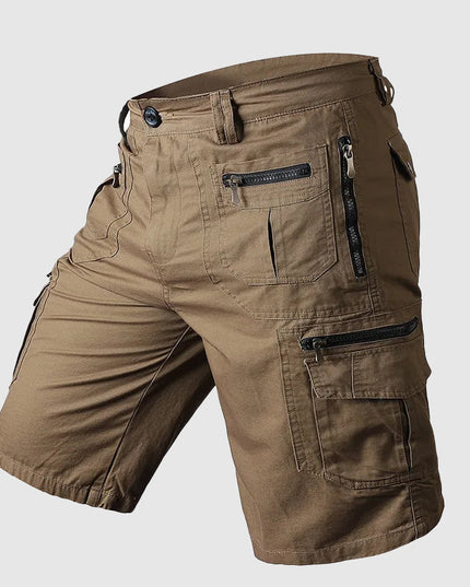 Khaki cargo shorts with multiple zippered pockets and belt loop detail