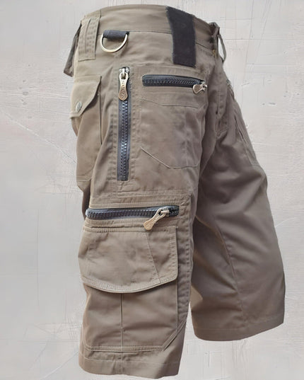 Khaki tan multi-pocket cargo shorts with reinforced seams and metal hardware details