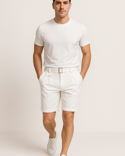 Cream tailored pleated shorts with buckle adjuster belt styled with white t-shirt
