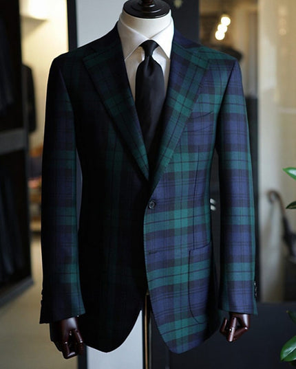 Front view of tartan plaid two button blazer on dress form with notch lapels