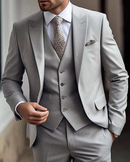 Full length view of grey three piece formal suit with grey vest and pocket square