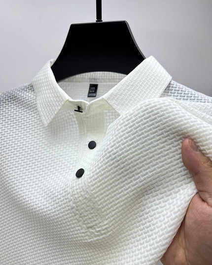 Close-up of white polo shirt waffle texture and button detail