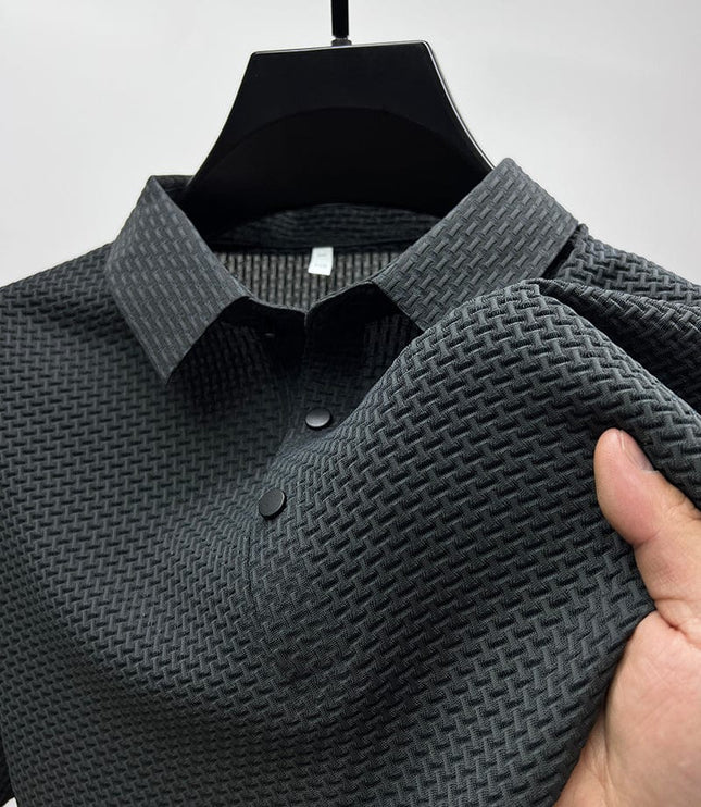 Close-up of charcoal polo shirt fabric texture and buttons
