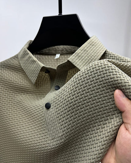 Close-up of light gray polo shirt fabric weave and buttons