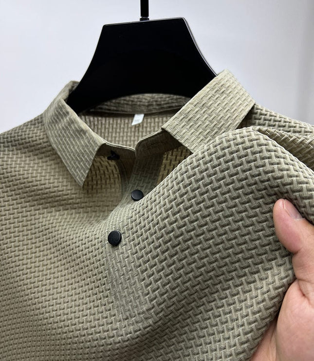 Close-up of light gray polo shirt fabric weave and buttons