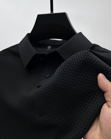 Close-up of black polo shirt textured fabric and collar