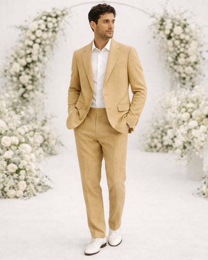 Tan linen suit on model with white shirt and white sneakers