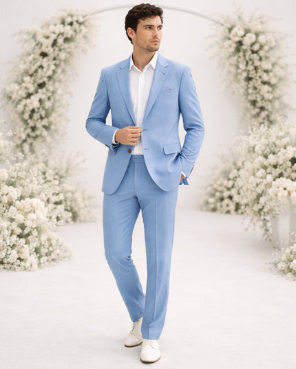 Light blue linen suit on model with white dress shirt and sneakers