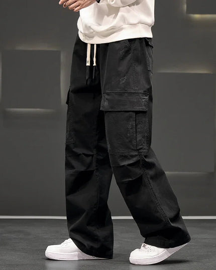 Black casual cargo pants with multiple pockets and straight wide leg cut