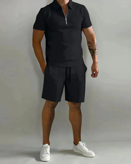 Black zip polo shirt paired with black shorts ensemble