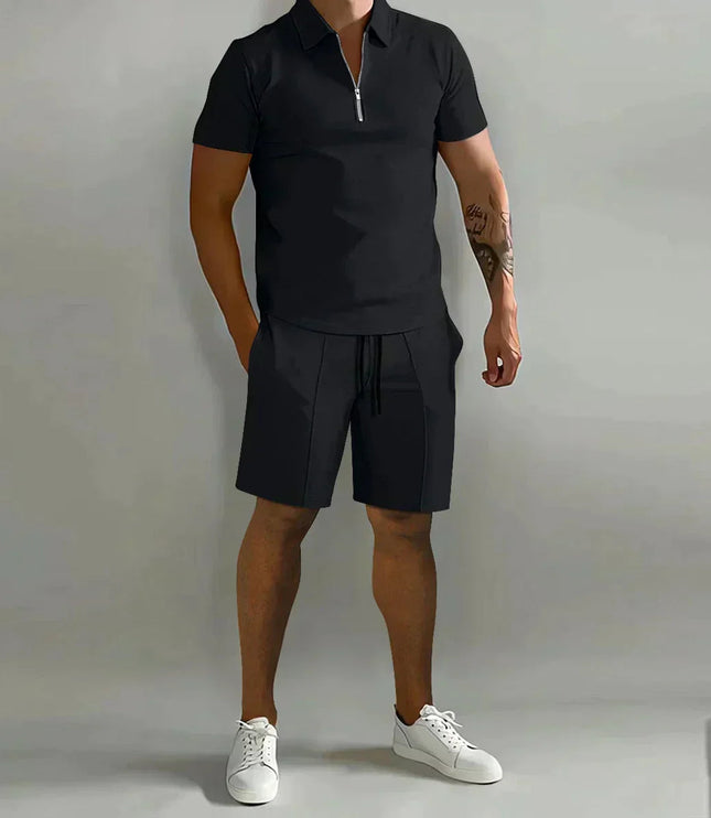 Black zip polo shirt paired with black shorts ensemble