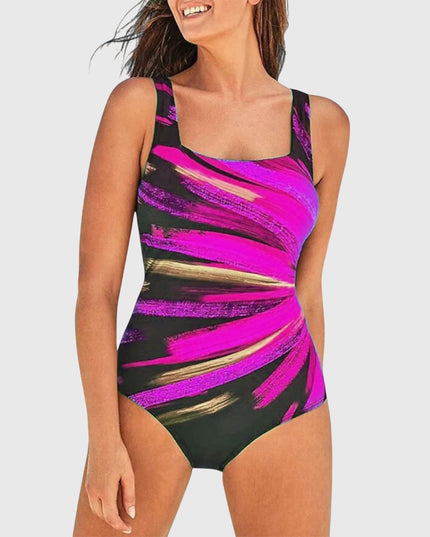 Women's one-piece swimsuit with magenta and black diagonal stripe print and control support