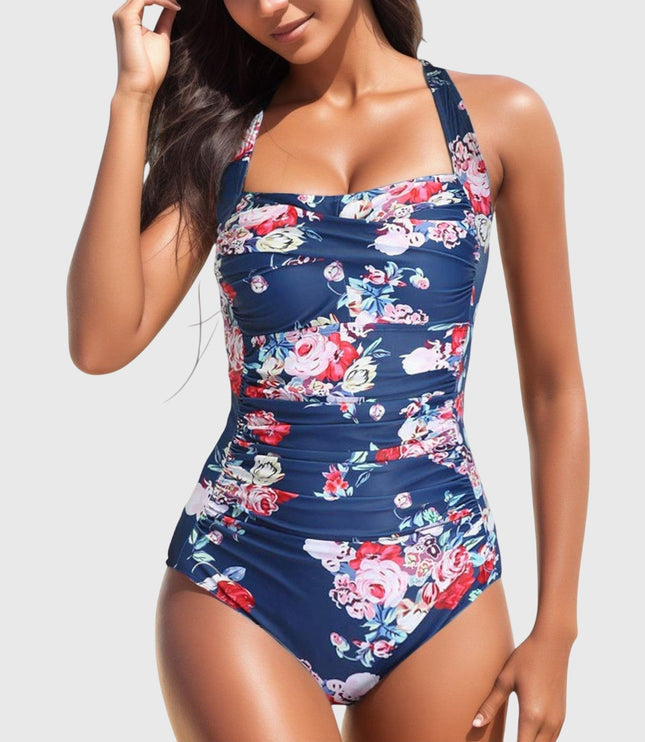 Navy one-piece swimsuit with pink and red rose floral pattern and ruching