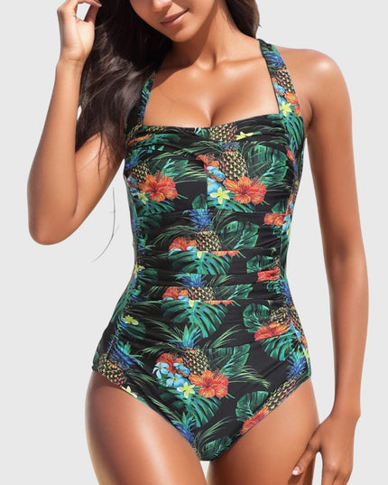 Black tropical floral one-piece swimsuit with ruching and pineapple print