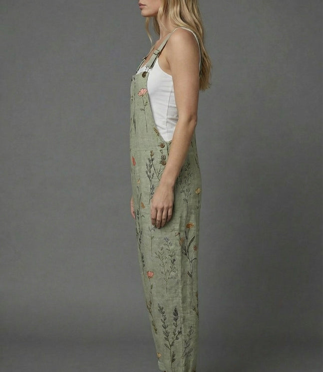 Side view of botanical print romper with relaxed fit, wide legs, and cuffed hems