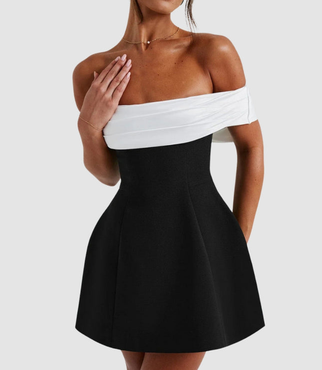 Women white and black cocktail mini dress showing off-shoulder neckline and fitted top