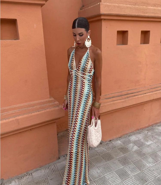 Full length view of a women's maxi dress with a colorful wave pattern and deep V-neck