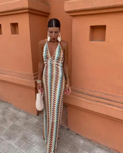 Front view of a women's patterned maxi sundress, featuring a deep V-neck and halter style