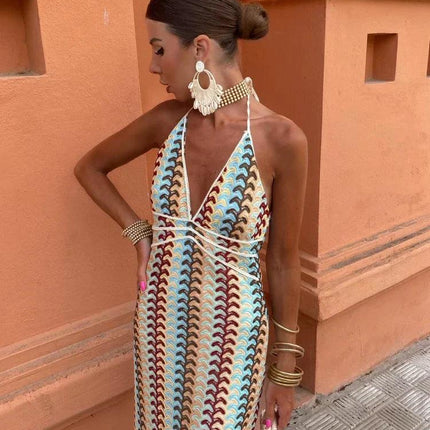 Women's deep V-neck maxi sundress with blue, brown, and cream wave pattern, halter neck tie