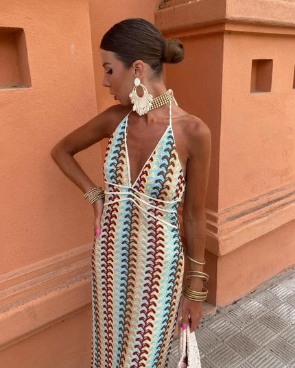 Women's deep V-neck maxi sundress with blue, brown, and cream wave pattern, halter neck tie