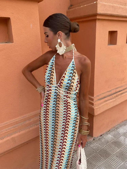 Women's deep V-neck maxi sundress with blue, brown, and cream wave pattern, halter neck tie