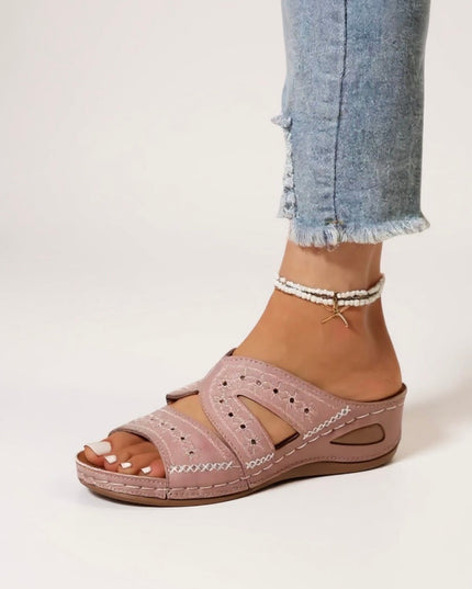 Mauve embroidered slide sandals with perforated straps and cushioned sole