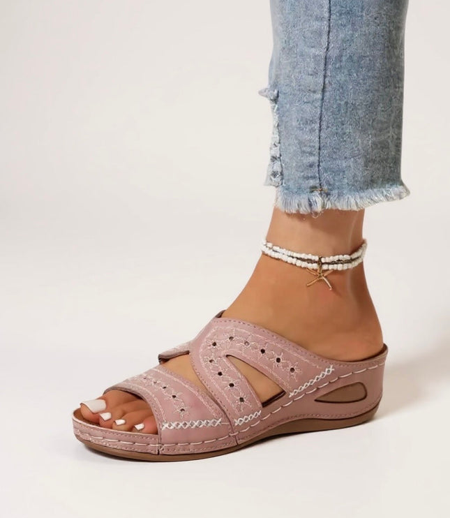 Mauve embroidered slide sandals with perforated straps and cushioned sole