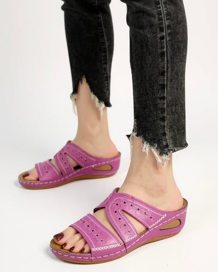 Magenta embroidered slide sandals with perforated straps and wedge sole