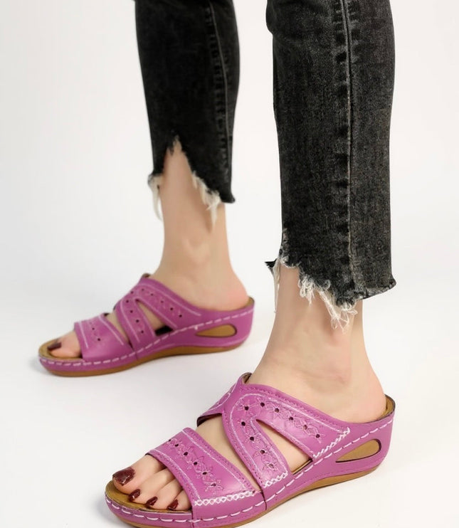 Magenta embroidered slide sandals with perforated straps and wedge sole