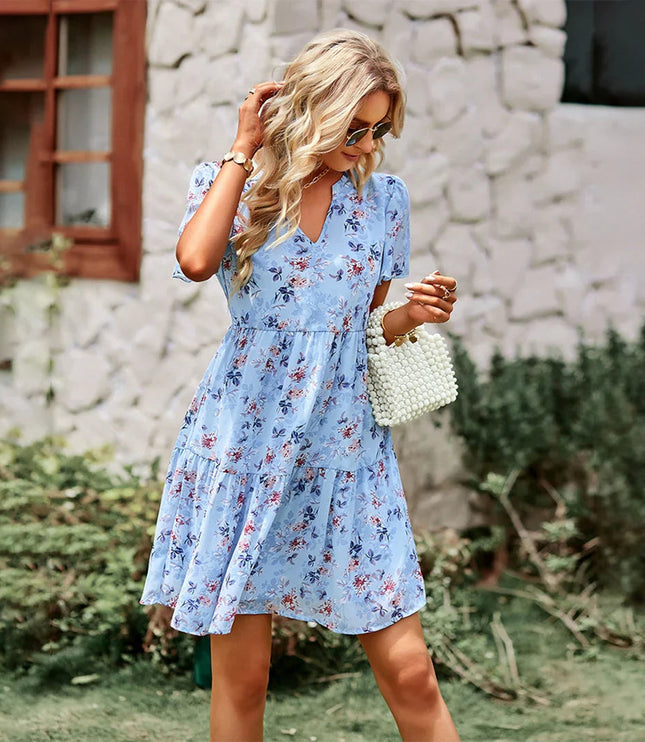 Women's light blue floral print mini sundress with a v-neck, short flutter sleeves, and a tiered hem.