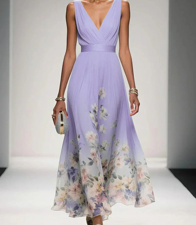 Lavender floral print v-neck sleeveless maxi dress with a delicate floral design along the hem, paired with a clutch.