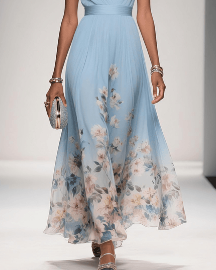 Lower body view of the light blue floral print v-neck sleeveless maxi dress, highlighting the flowing skirt and floral pattern.