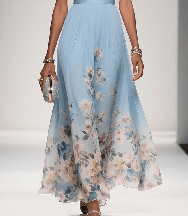 Lower body view of the light blue floral print v-neck sleeveless maxi dress, highlighting the flowing skirt and floral pattern.
