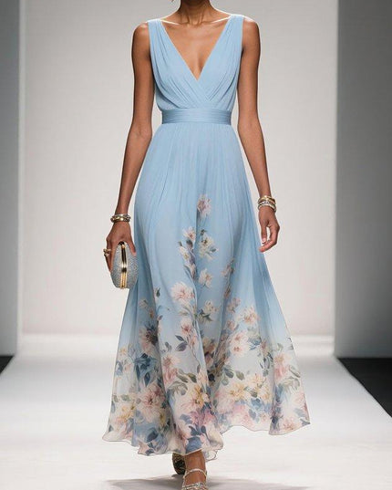 Full view of the light blue floral print v-neck sleeveless maxi dress, showcasing its elegant drape and soft floral design.