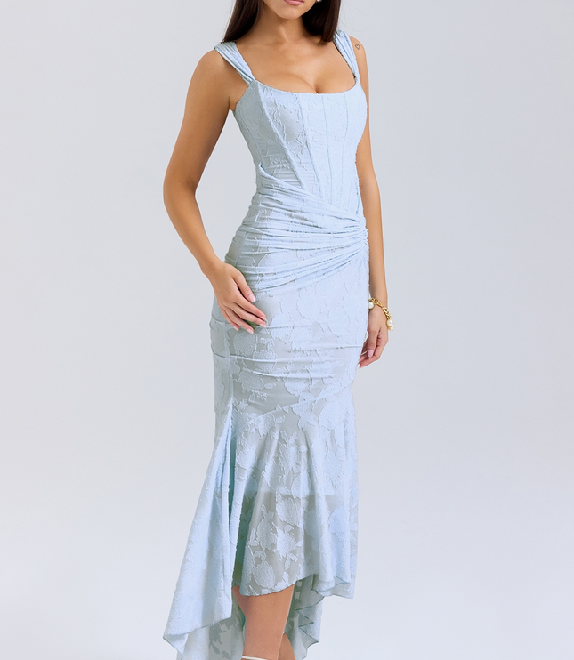 Three-quarter view of the light blue women's floral midi dress, featuring a structured corset top and a flowing asymmetric skirt.