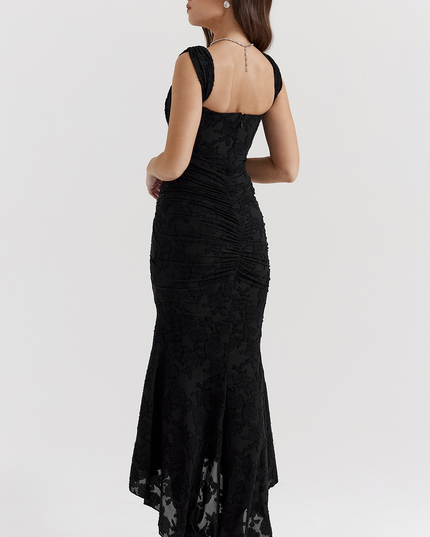 Back view of the black floral corset midi dress, showcasing the ruched detail on the back and the elegant asymmetric hem.