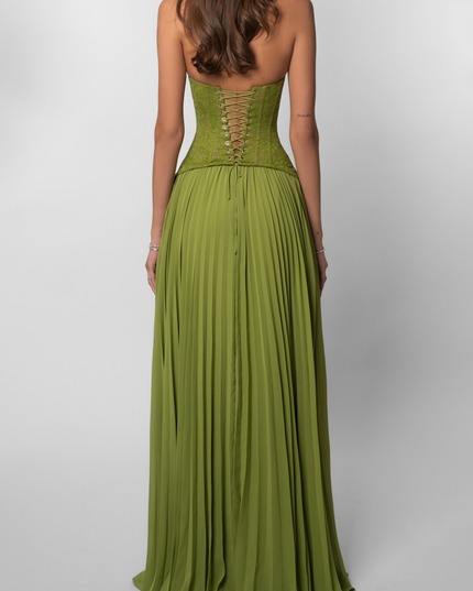 Back view of a women's halter floral lace pleated maxi dress in a vibrant green, with a corset-style lace-up back.