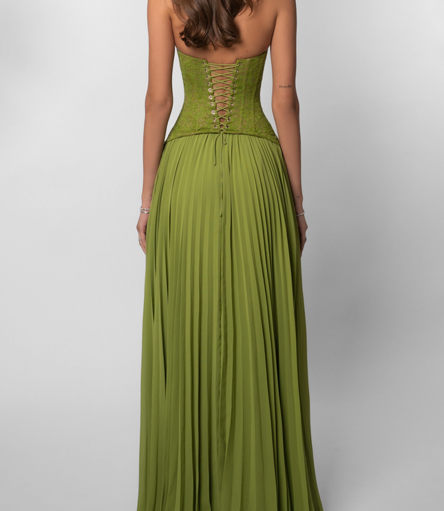 Back view of a women's halter floral lace pleated maxi dress in a vibrant green, with a corset-style lace-up back.