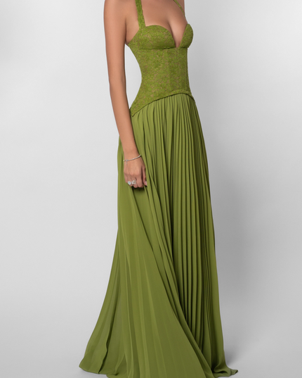 Front 3/4 view of a women's green halter floral lace pleated maxi dress, highlighting the lace bustier and pleated skirt.