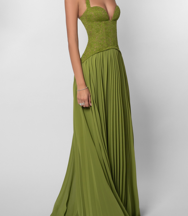 Front 3/4 view of a women's green halter floral lace pleated maxi dress, highlighting the lace bustier and pleated skirt.