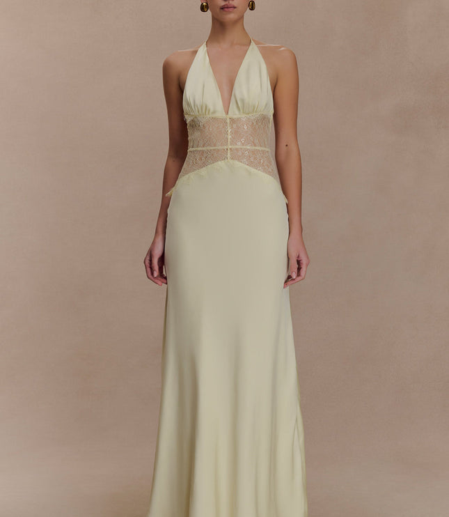Pale yellow halter neck maxi dress with a deep V-neck and matching yellow lace detail on the bodice, front view.